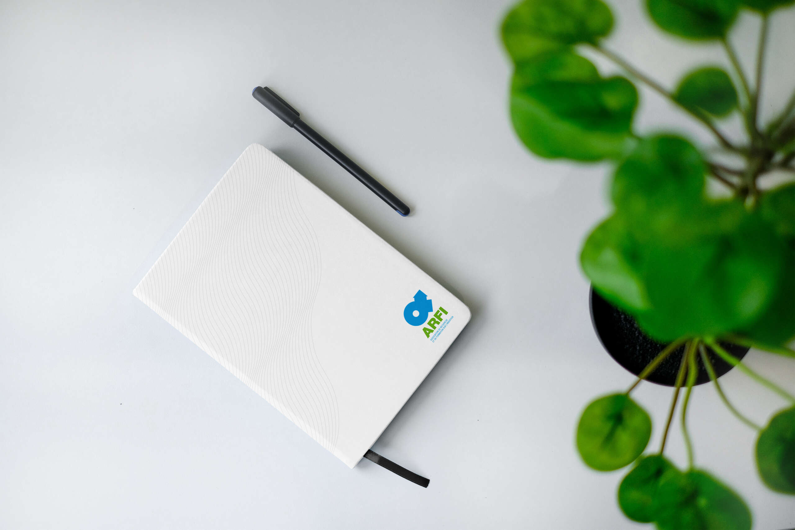 ARFI-logo-mockup-notebook